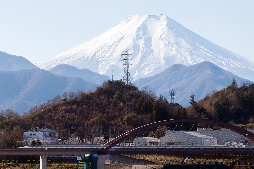 Maglev bullet train in Japan, the Japanese Alps in the background